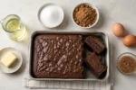 Brownie assado ao centro com comparações entre manteiga e óleo, açúcar branco e mascavo, ovos e gel de linhaça.